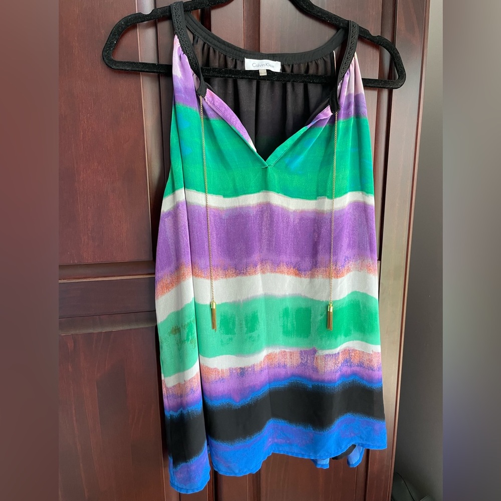 Calvin Klein flowy top. Unique accents. Lined. Beautiful colors. Gently used. XL